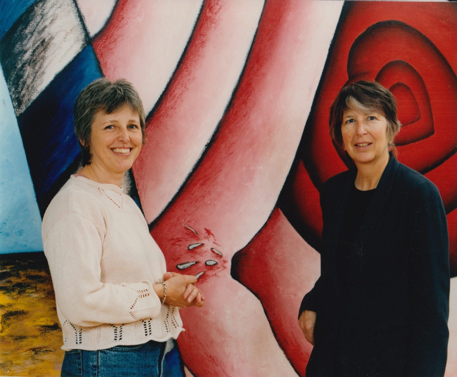 Professors Dawn Ades and Valerie Fraser with artwork from ESCALA
